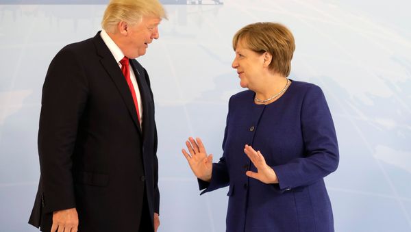 German Chancellor Angela Merkel meets U.S. President Donald Trump on the eve of the G-20 summit in Hamburg, Germany, July 6, 2017 German Chancellor Angela Merkel meets U.S. President Donald Trump on the eve of the G-20 summit in Hamburg, Germany, July 6, 2017 - Sputnik International