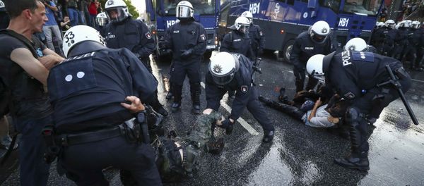 German riot police detain protesters during the demonstrations during the G20 summit in Hamburg, Germany, July 6, 2017 German riot police detain protesters during the demonstrations during the G20 summit in Hamburg, Germany, July 6, 2017 - Sputnik International