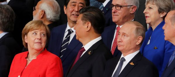 German Chancellor Angela Merkel, Chinese President Xi Jinping, Russian President Vladimir Putin, Turkish President Recep Tayyip Erdogan Japanese Prime Minister Shinzo Abe, Australian Prime Minister Malcolm Turnbull Britain's Prime Minister Theresa May prepare for a family photo at the G20 leaders summit in Hamburg, Germany July 7, 2017 German Chancellor Angela Merkel, Chinese President Xi Jinping, Russian President Vladimir Putin, Turkish President Recep Tayyip Erdogan Japanese Prime Minister Shinzo Abe, Australian Prime Minister Malcolm Turnbull Britain's Prime Minister Theresa May prepare for a family photo at the G20 leaders summit in Hamburg, Germany July 7, 2017 - Sputnik International