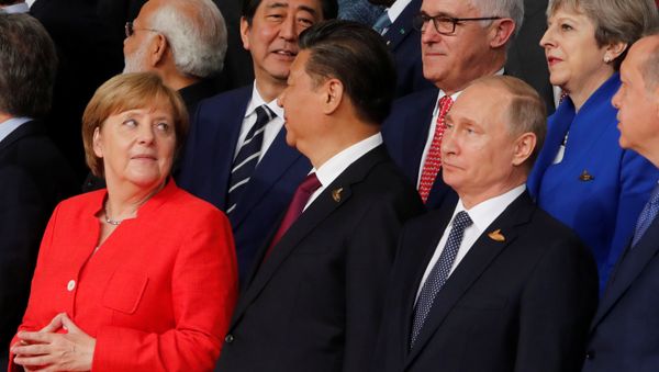 German Chancellor Angela Merkel, Chinese President Xi Jinping, Russian President Vladimir Putin, Turkish President Recep Tayyip Erdogan Japanese Prime Minister Shinzo Abe, Australian Prime Minister Malcolm Turnbull Britain's Prime Minister Theresa May prepare for a family photo at the G20 leaders summit in Hamburg, Germany July 7, 2017 German Chancellor Angela Merkel, Chinese President Xi Jinping, Russian President Vladimir Putin, Turkish President Recep Tayyip Erdogan Japanese Prime Minister Shinzo Abe, Australian Prime Minister Malcolm Turnbull Britain's Prime Minister Theresa May prepare for a family photo at the G20 leaders summit in Hamburg, Germany July 7, 2017 - Sputnik International
