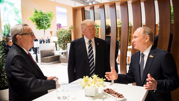 U.S. President Donald Trump, Russia's President Vladimir Putin and President of the European Commission Jean-Claude Juncker talk during the G20 Summit in Hamburg, Germany in this still image taken from video, July 7, 2017 U.S. President Donald Trump, Russia's President Vladimir Putin and President of the European Commission Jean-Claude Juncker talk during the G20 Summit in Hamburg, Germany in this still image taken from video, July 7, 2017 - Sputnik International