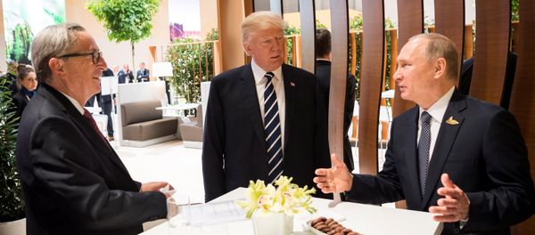U.S. President Donald Trump, Russia's President Vladimir Putin and President of the European Commission Jean-Claude Juncker talk during the G20 Summit in Hamburg, Germany in this still image taken from video, July 7, 2017 U.S. President Donald Trump, Russia's President Vladimir Putin and President of the European Commission Jean-Claude Juncker talk during the G20 Summit in Hamburg, Germany in this still image taken from video, July 7, 2017 - Sputnik International