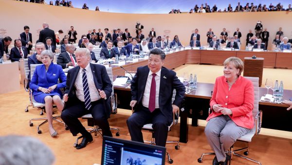 (L-R) US President Donald Trump, China's President Xi Jinping, German Chancellor Angela Merkel, Argentinia's President Mauricio Macri and Australia's Prime Minister Malcolm Turnbull turn around for photographers at the start of the first working sessionthe G20 summit in Hamburg, Germany, July 7, 2017 (L-R) US President Donald Trump, China's President Xi Jinping, German Chancellor Angela Merkel, Argentinia's President Mauricio Macri and Australia's Prime Minister Malcolm Turnbull turn around for photographers at the start of the first working sessionthe G20 summit in Hamburg, Germany, July 7, 2017 - Sputnik International