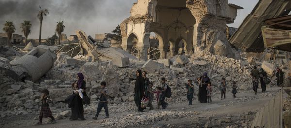 Fleeing Iraqi civilians walk past the heavily damaged al-Nuri mosque as Iraqi forces continue their advance against Islamic State militants in the Old City of Mosul, Iraq, Tuesday, July 4, 2017 Fleeing Iraqi civilians walk past the heavily damaged al-Nuri mosque as Iraqi forces continue their advance against Islamic State militants in the Old City of Mosul, Iraq, Tuesday, July 4, 2017 - Sputnik International