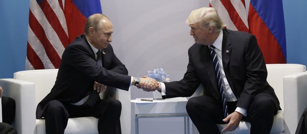 President Donald Trump shakes hands with Russian President Vladimir Putin at the G20 Summit, Friday, July 7, 2017, in Hamburg - Sputnik International
