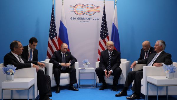 Russia's President Vladimir Putin sits next to U.S. President Donald Trump during their bilateral meeting at the G20 summit in Hamburg, Germany July 7, 2017 Russia's President Vladimir Putin sits next to U.S. President Donald Trump during their bilateral meeting at the G20 summit in Hamburg, Germany July 7, 2017 - Sputnik International