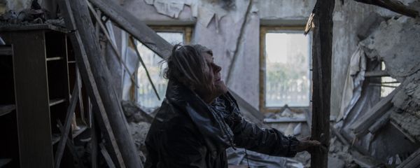 A resident of the village of Staromikhailovka, damaged by a shelling, in the Donetsk region. A resident of the village of Staromikhailovka, damaged by a shelling, in the Donetsk region. - Sputnik International