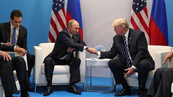 Russian President Vladimir Putin and President of the USA Donald Trump, right, talk during their meeting on the sidelines of the G20 summit in Hamburg Russian President Vladimir Putin and President of the USA Donald Trump, right, talk during their meeting on the sidelines of the G20 summit in Hamburg - Sputnik International