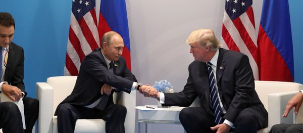 Russian President Vladimir Putin and President of the USA Donald Trump, right, talk during their meeting on the sidelines of the G20 summit in Hamburg - Sputnik International