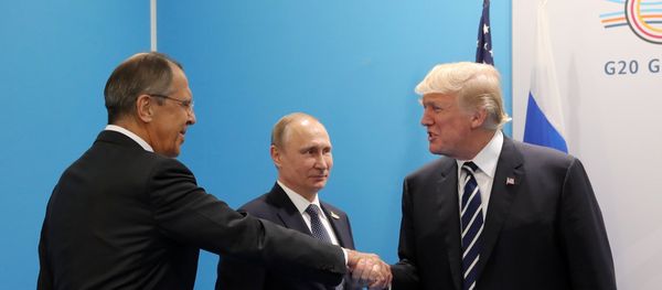 Russian President Vladimir Putin and President of the USA Donald Trump, right, talk during their meeting on the sidelines of the G20 summit in Hamburg. Left: Russian Foreign Minister Sergei Lavrov. Russian President Vladimir Putin and President of the USA Donald Trump, right, talk during their meeting on the sidelines of the G20 summit in Hamburg. Left: Russian Foreign Minister Sergei Lavrov. - Sputnik International
