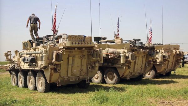 This Saturday, April. 29, 2017 still taken from video, shows an American soldier standing on an armored vehicle in the northern village of Darbasiyah, Syria. U.S - Sputnik International