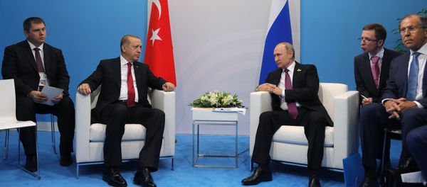 Russian President Vladimir Putin and President of Turkey Recep Tayyip Erdogan, second left, talk during their meeting on the sidelines of the G20 summit in Hamburg. Right: Russian Foreign Minister Sergei Lavrov Russian President Vladimir Putin and President of Turkey Recep Tayyip Erdogan, second left, talk during their meeting on the sidelines of the G20 summit in Hamburg. Right: Russian Foreign Minister Sergei Lavrov - Sputnik International