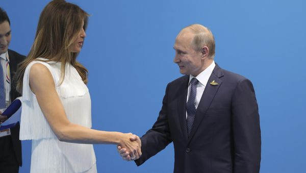Russian President Vladimir Putin (R) shakes hands with U.S. First Lady Melania Trump during a meeting on the sidelines of the G20 summit in Hamburg, Germany July 7, 2017 Russian President Vladimir Putin (R) shakes hands with U.S. First Lady Melania Trump during a meeting on the sidelines of the G20 summit in Hamburg, Germany July 7, 2017 - Sputnik International