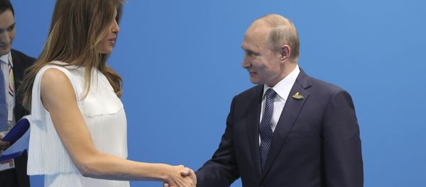 Russian President Vladimir Putin (R) shakes hands with U.S. First Lady Melania Trump during a meeting on the sidelines of the G20 summit in Hamburg, Germany July 7, 2017 Russian President Vladimir Putin (R) shakes hands with U.S. First Lady Melania Trump during a meeting on the sidelines of the G20 summit in Hamburg, Germany July 7, 2017 - Sputnik International
