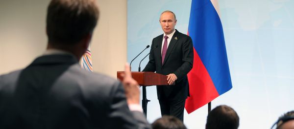Russian President Vladimir Putin answers journalists' questions during a news conference summing up the results of the G20 summit in Hamburg - Sputnik International