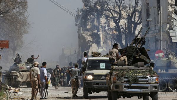 Members of Libyan National Army (LNA) gather after the liberation of Islamist militants' last stronghold in Benghazi, Libya, July 6, 2017 - Sputnik International
