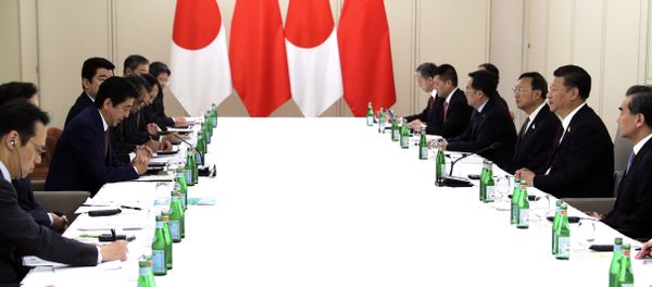 In this photo released by China's Xinhua News Agency, Japanese Prime Minister Shinzo Abe, second from left, and Chinese President Xi Jinping, second from right, meet on the sidelines of the G20 summit in Hamburg, Germany, Saturday, July 8, 2017. In this photo released by China's Xinhua News Agency, Japanese Prime Minister Shinzo Abe, second from left, and Chinese President Xi Jinping, second from right, meet on the sidelines of the G20 summit in Hamburg, Germany, Saturday, July 8, 2017. - Sputnik International