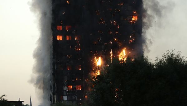 Smoke and flames rise from a building on fire in London, Wednesday, June 14, 2017. - Sputnik International