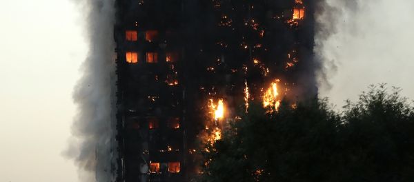Smoke and flames rise from a building on fire in London, Wednesday, June 14, 2017. Smoke and flames rise from a building on fire in London, Wednesday, June 14, 2017. - Sputnik International