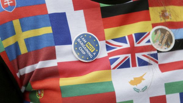 A demonstrator wears a badge in Parliament Square before a group of EU citizens of several nationalities, and including nurses, social workers and teaching assistants, lobby Members of Parliament over their right to remain in the UK, in London, Monday Feb. 20, 2017. - Sputnik International