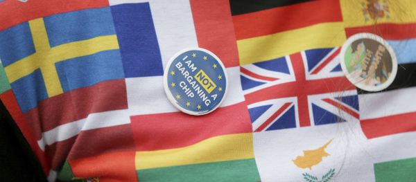 A demonstrator wears a badge in Parliament Square before a group of EU citizens of several nationalities, and including nurses, social workers and teaching assistants, lobby Members of Parliament over their right to remain in the UK, in London, Monday Feb. 20, 2017. - Sputnik International