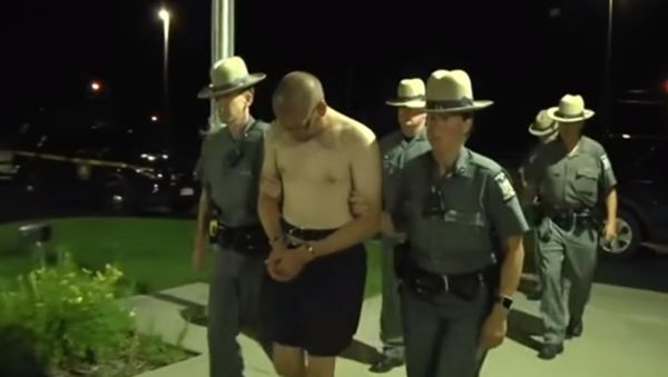 US Army Staff Sgt. Justin Walters,32, being led by police after killing his wife and a New York State Trooper - Sputnik International
