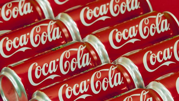 FILE - This July 15, 2013 file photo shows cans of Coca-Cola in Doral, Fla. - Sputnik International