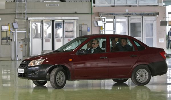 Russian Prime Minister Vladimir Putin, left, takes the Lada Kalina model-based new Lada-Granta car for a drive at AvtoVAZ plant in Togliatti. May 11, 2011. Russian Prime Minister Vladimir Putin, left, takes the Lada Kalina model-based new Lada-Granta car for a drive at AvtoVAZ plant in Togliatti. May 11, 2011. - Sputnik International