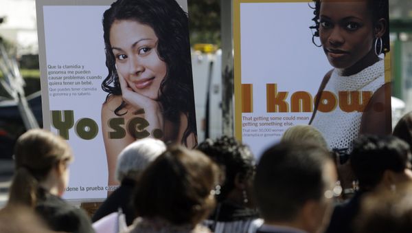 Public service posters in English and Spanish are seen at a news conference to announce a Los Angeles County program to provide young women in South Los Angeles with home-testing kits for sexually transmitted diseases, at a news conference in the Watts-Willowbrook area of Los Angeles Monday, Sept. 19, 2011. Public service posters in English and Spanish are seen at a news conference to announce a Los Angeles County program to provide young women in South Los Angeles with home-testing kits for sexually transmitted diseases, at a news conference in the Watts-Willowbrook area of Los Angeles Monday, Sept. 19, 2011. - Sputnik International