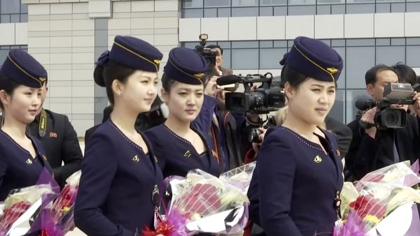 In this image taken from video, Air Koryo cabin crew wait with flowers on tarmac for the airline's first flight from Dandong, at Sunan airport in Pyongyang, North Korea Tuesday, March 28, 2017. In this image taken from video, Air Koryo cabin crew wait with flowers on tarmac for the airline's first flight from Dandong, at Sunan airport in Pyongyang, North Korea Tuesday, March 28, 2017. - Sputnik International