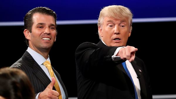 Donald Trump Jr. (L) gives a thumbs up beside his father Republican U.S. presidential nominee Donald Trump (R) after Trump's debate against Democratic nominee Hillary Clinton at Hofstra University in Hempstead, New York, U.S. September 26, 2016. - Sputnik International