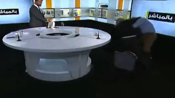A brawl between Syrian MP Ahmad Shalash and Lebanese Sunni Islamist cleric Bilal Duqmaq breaks out on Lebanese talk show Bel Moubashar. - Sputnik International