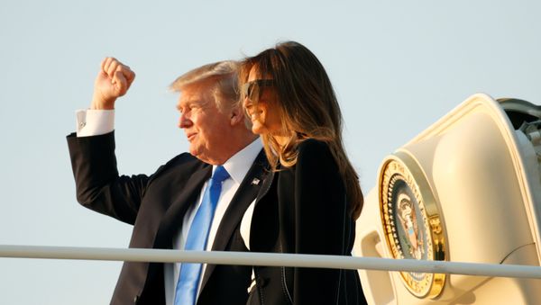 U.S. President Donald Trump and first lady Melania Trump board Air Force One as they depart Joint Base Andrews in Maryland, U.S., enroute to Paris July 12, 2017. - Sputnik International