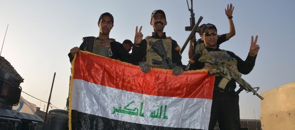 Iraqi security forces celebrate as Prime Minister Haider al-Abadi announces victory over Islamic State in Mosul, in Mosul, Iraq July 10, 2017. - Sputnik International