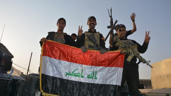 Iraqi security forces celebrate as Prime Minister Haider al-Abadi announces victory over Islamic State in Mosul, in Mosul, Iraq July 10, 2017. Iraqi security forces celebrate as Prime Minister Haider al-Abadi announces victory over Islamic State in Mosul, in Mosul, Iraq July 10, 2017. - Sputnik International