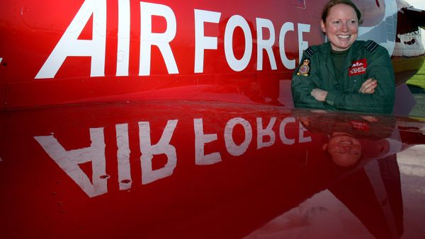 Flight Lieutenant Kirsty Moore poses in front of a Hawk aircraft at the Royal Air Force base at Scampton, England, Thursday Nov. 12, 2009, after being named as the first female pilot to serve with the Red Arrows, the RAF's aerobatic team. Flight Lieutenant Kirsty Moore poses in front of a Hawk aircraft at the Royal Air Force base at Scampton, England, Thursday Nov. 12, 2009, after being named as the first female pilot to serve with the Red Arrows, the RAF's aerobatic team. - Sputnik International