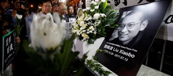 Pro-democracy activists mourn the death of Chinese Nobel Peace laureate Liu Xiaobo, outside China's Liaison Office in Hong Kong, China July 13, 2017. Pro-democracy activists mourn the death of Chinese Nobel Peace laureate Liu Xiaobo, outside China's Liaison Office in Hong Kong, China July 13, 2017. - Sputnik International