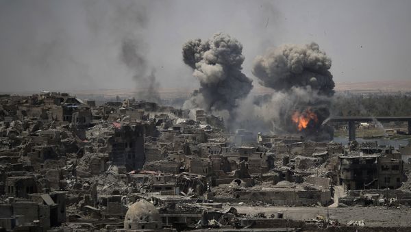 Airstrikes target Islamic State positions on the edge of the Old City a day after Iraq's prime minister declared total victory in Mosul, Iraq, Tuesday, July 11, 2017 - Sputnik International