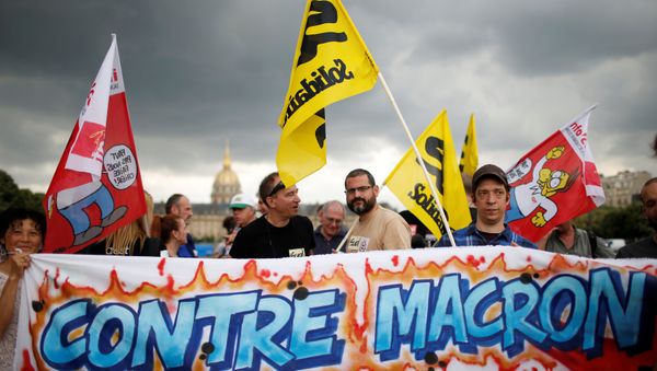 French unions gather to protest work precariousness as France's new parliament will sit for the first time at the Invalides square in Paris, France June 27, 2017. Placard reads: Against Macron - Sputnik International