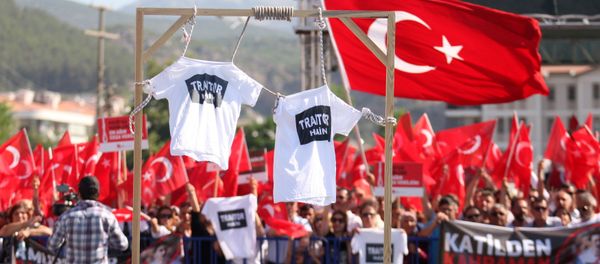 Supporters of President Tayyip Erdogan wave Turkish flags as shirts hung on gallows are seen in the foreground during a trial for soldiers accused of attempting to assassinate the president on the night of the failed last year's July 15, 2016 coup, in Mugla, Turkey July 14, 2017. Supporters of President Tayyip Erdogan wave Turkish flags as shirts hung on gallows are seen in the foreground during a trial for soldiers accused of attempting to assassinate the president on the night of the failed last year's July 15, 2016 coup, in Mugla, Turkey July 14, 2017. - Sputnik International