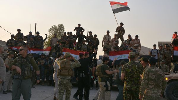 Iraqi security forces celebrate as Prime Minister Haider al-Abadi announces victory over Islamic State in Mosul, in Mosul, Iraq July 10, 2017 - Sputnik International
