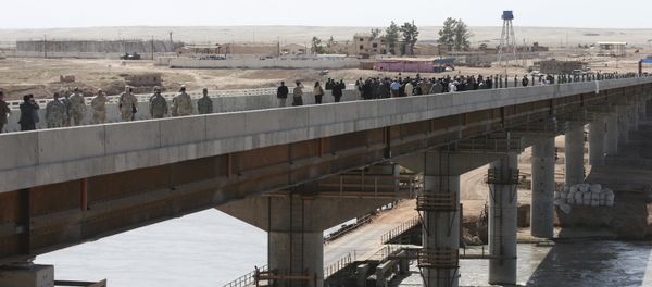 People walk along a bridge unveiled at the Tajik-Afghan border in Nizhny Pyandzh, Tajikistan (File) People walk along a bridge unveiled at the Tajik-Afghan border in Nizhny Pyandzh, Tajikistan (File) - Sputnik International