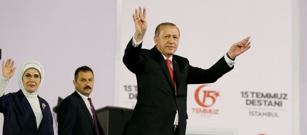 Turkish President Tayyip Erdogan and his wife Emine Erdogan greet their supporters as they arrive for a ceremony marking the first anniversary of the attempted coup at the Bosphorus Bridge in Istanbul, Turkey July 15, 2017 - Sputnik International