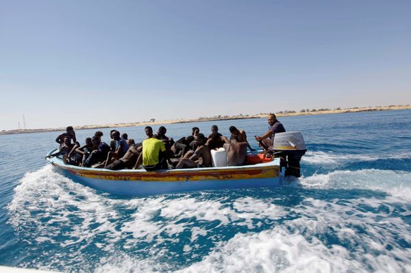 Migrants ride in a boat after they were rescued by Libyan coastguard off the coast of Gharaboli, east of Tripoli, Libya July 8, 2017 - Sputnik International