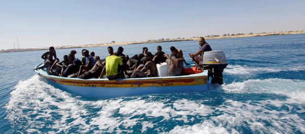 Migrants ride in a boat after they were rescued by Libyan coastguard off the coast of Gharaboli, east of Tripoli, Libya July 8, 2017 Migrants ride in a boat after they were rescued by Libyan coastguard off the coast of Gharaboli, east of Tripoli, Libya July 8, 2017 - Sputnik International
