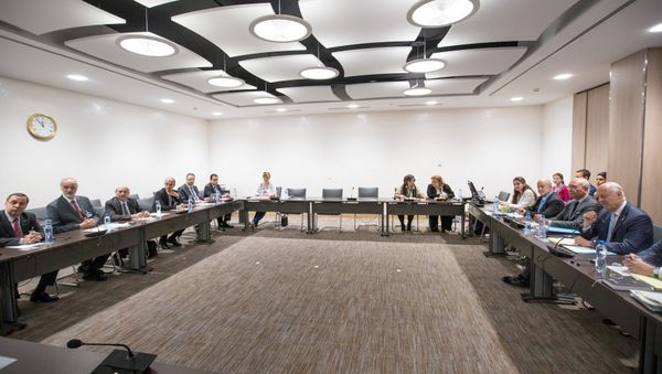 UN Special Envoy of the Secretary-General for Syria Staffan de Mistura (1st R) attends a new round of negotiation with Syrian Ambassador to the United Nations and head of the government delegation Bashar al-Jaafari (2nd L) during the intra-Syrian talks, at Palais des Nations in Geneva, Switzerland, 14 July 2017 - Sputnik International