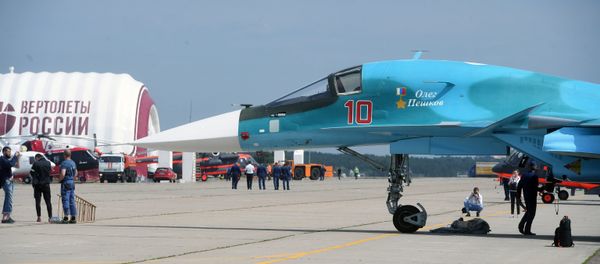 SU-34 bomber on a field during preparations for the opening of the Maks 2017 International Aviation and Space Salon in Zhukovsky. SU-34 bomber on a field during preparations for the opening of the Maks 2017 International Aviation and Space Salon in Zhukovsky. - Sputnik International
