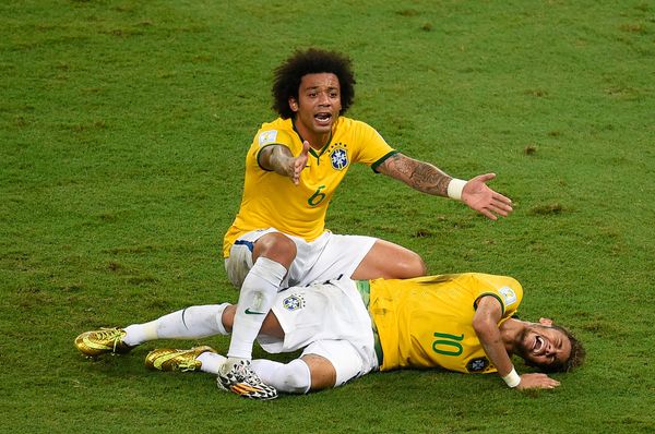 Brazil's defender Marcelo (back) reacts over Brazil's forward Neymar after he was injured following a tackle during the quarter-final football match between Brazil and Colombia at the Castelao Stadium in Fortaleza during the 2014 FIFA World Cup on July 4, 2014. Brazil's defender Marcelo (back) reacts over Brazil's forward Neymar after he was injured following a tackle during the quarter-final football match between Brazil and Colombia at the Castelao Stadium in Fortaleza during the 2014 FIFA World Cup on July 4, 2014. - Sputnik International
