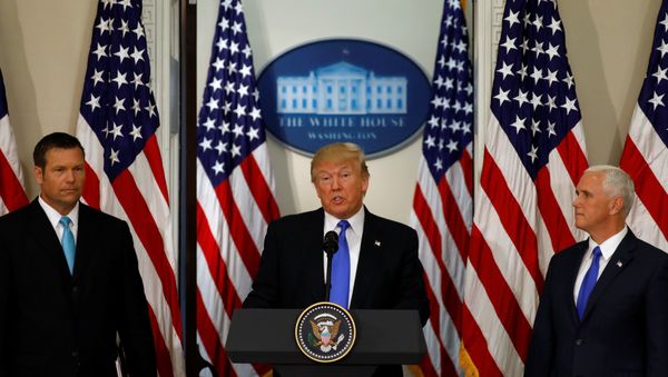U.S. President Donald Trump speaks at the first meeting of the Presidential Advisory Commission on Election Integrity co-chaired by Kansas Secretary of State Kris Kobach (L) and Vice President Mike Pence (R) at the White House in Washington, U.S., July 19, 2017. - Sputnik International