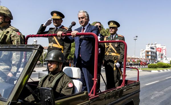Turkish Cypriot leader Mustafa Akinci (C) rides in an army vehicle as he attends a parade in the northern part of Nicosia, the capital of the self-proclaimed Turkish Republic of Northern Cyprus (TRNC), on July 20, 2017 to mark the 43rd anniversary of the Turkish invasion of northern Cyprus in 1974. Turkish Cypriot leader Mustafa Akinci (C) rides in an army vehicle as he attends a parade in the northern part of Nicosia, the capital of the self-proclaimed Turkish Republic of Northern Cyprus (TRNC), on July 20, 2017 to mark the 43rd anniversary of the Turkish invasion of northern Cyprus in 1974. - Sputnik International